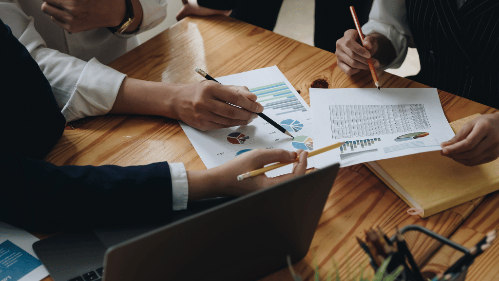 Office workers analyzing financial reports